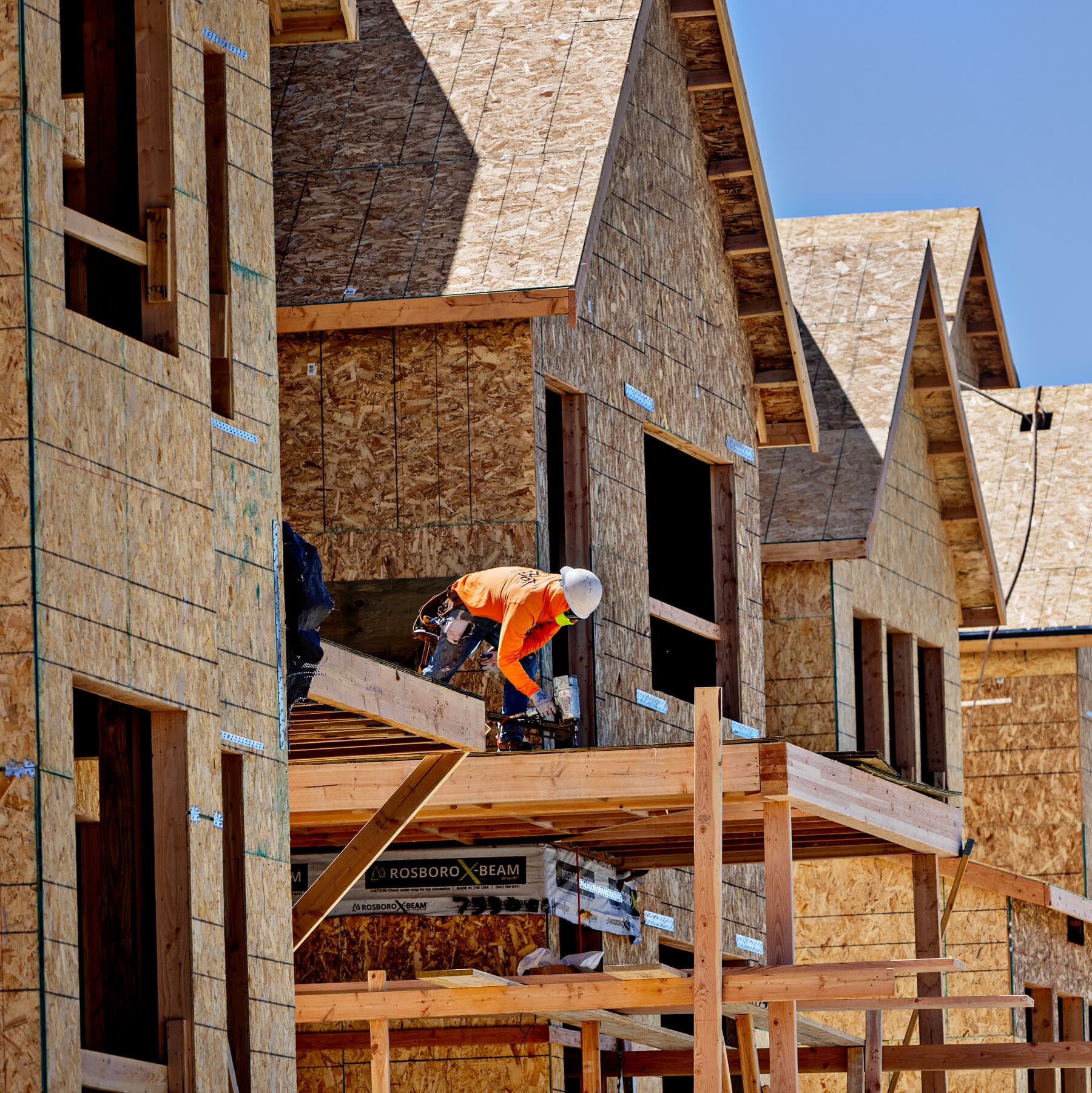 Construction worker framing a residential build